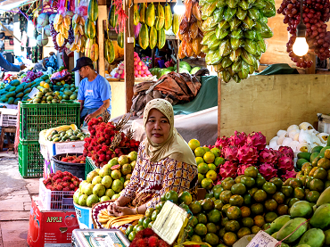 Woman selling fruits in a market in Phillipines