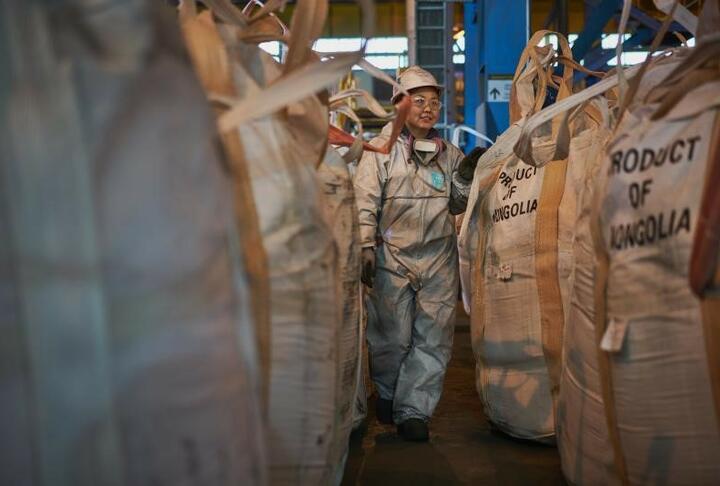 Worker with protective gear walking on a factory in Mongolia
