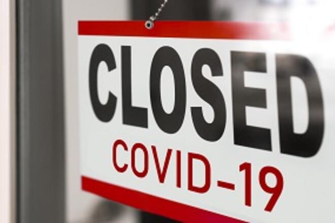 Closed COVID-19 sign on a window