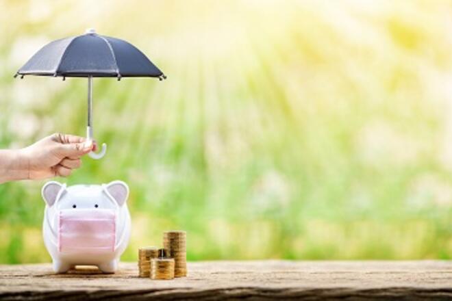 piggy bank with mask under umbrella
