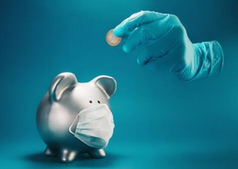 piggy bank with mask and hand with gloves and a coin