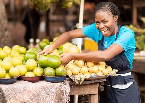 African woman selling produce in a market